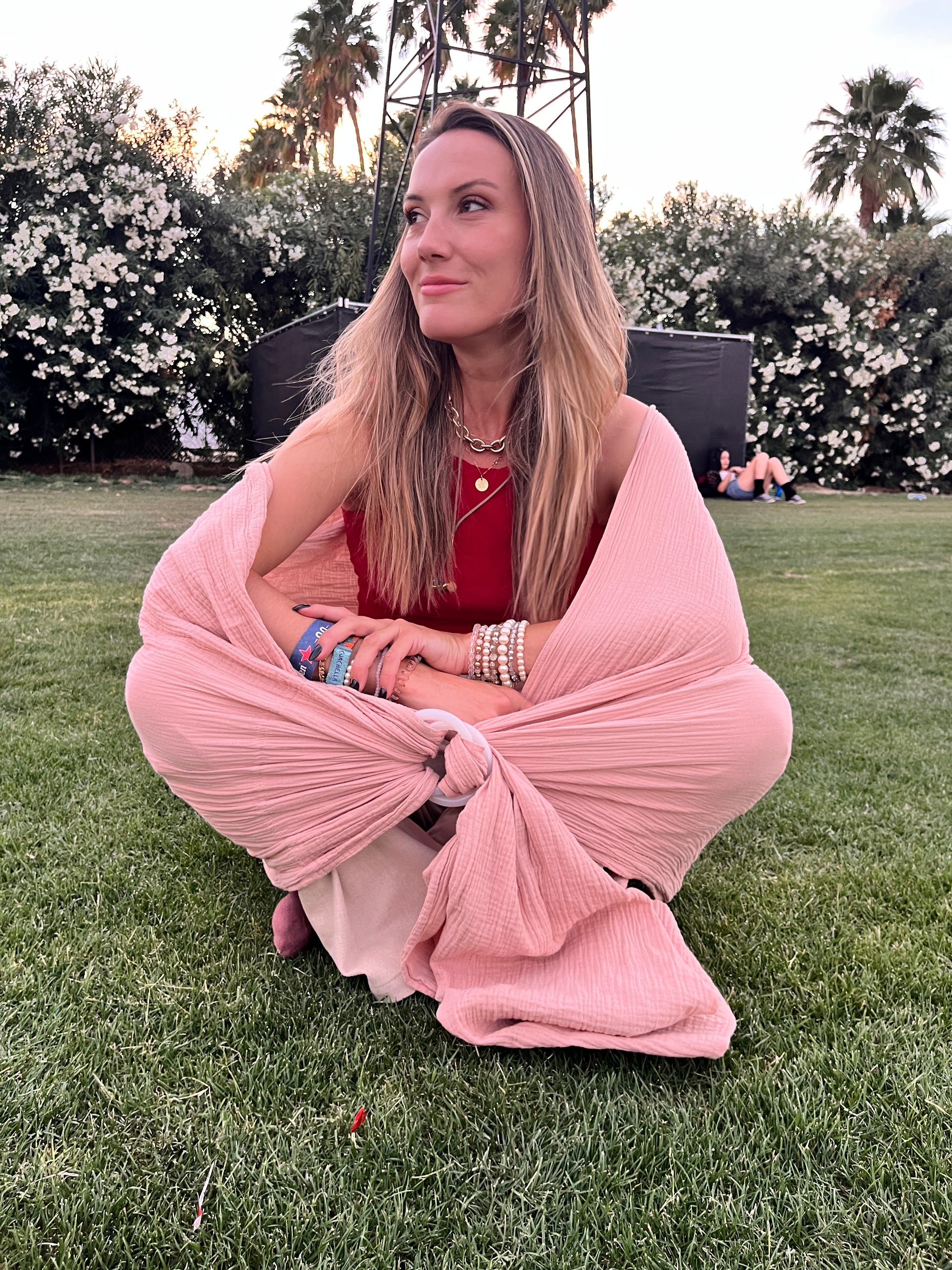 BLUSH SUNCHILD SLING BEING USED BY NATALIE AS A HAMMOK SEAT AT THE COACHELLA MUSIC FESTIVAL